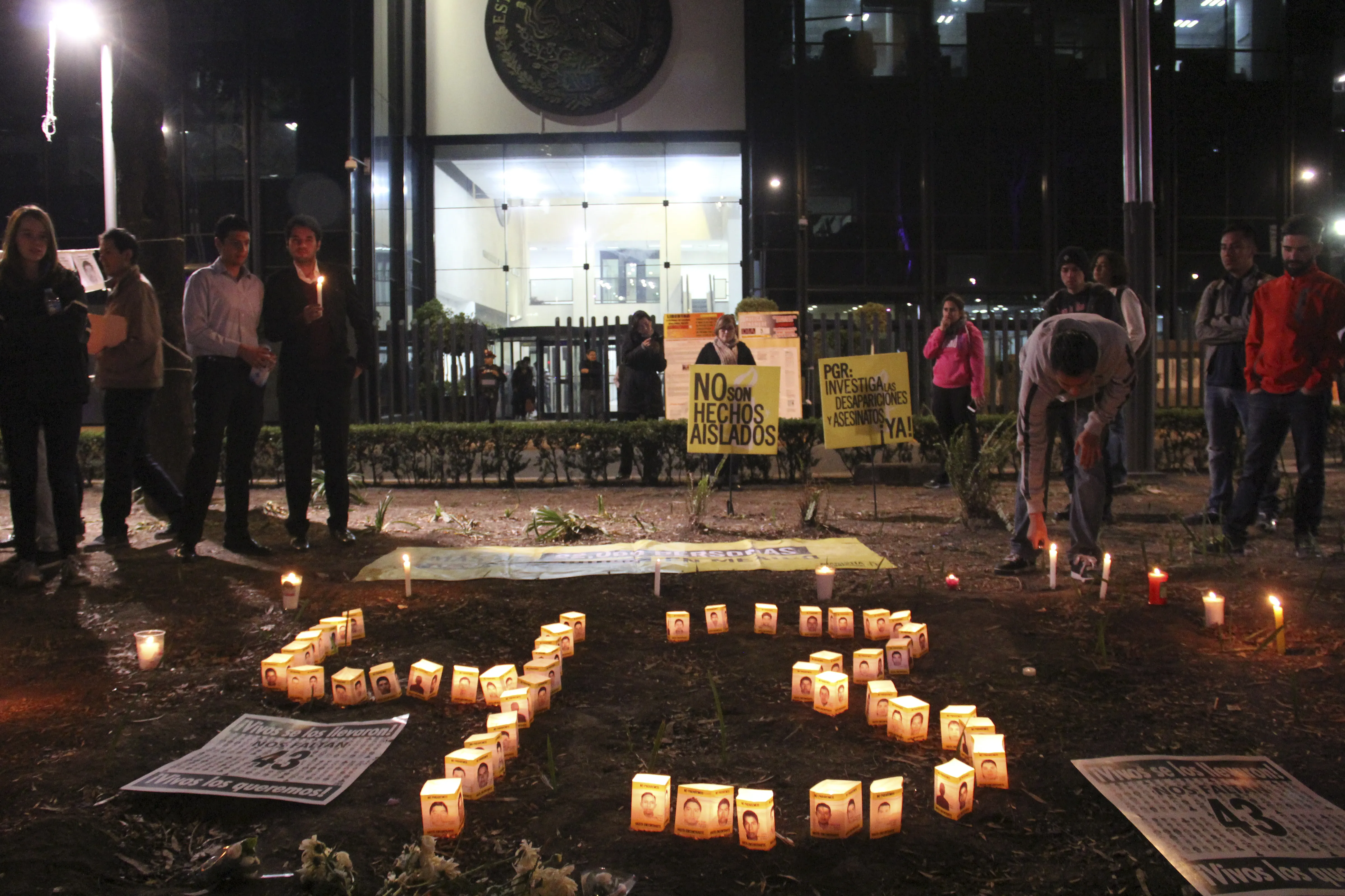 Candles are lit to form the shape of the number 43 at a rally organized by Amnesty International outside the Attorney General of Mexico office marking six months since 43 Ayotzinapa students went missing. (LUIS RAMON BARRON TINAJERO/ Demotix)
