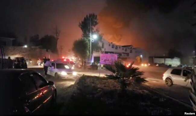 People react at the scene where a ruptured fuel pipeline exploded, in the municipality of Tlahuelilpan, Hidalgo, Mexico, near the Tula refinery of state oil firm Petroleos Mexicanos (Pemex), Jan. 18, 2019.
